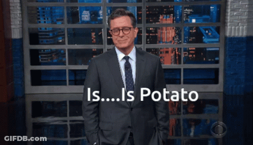 Man In Suit In Front Of Wall Saying Is Potato GIF