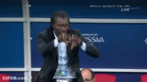 Man In Suit In Front Of Wall Saying Russia GIF