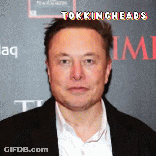 Man In Suit In Front Of Wall Saying Time GIF