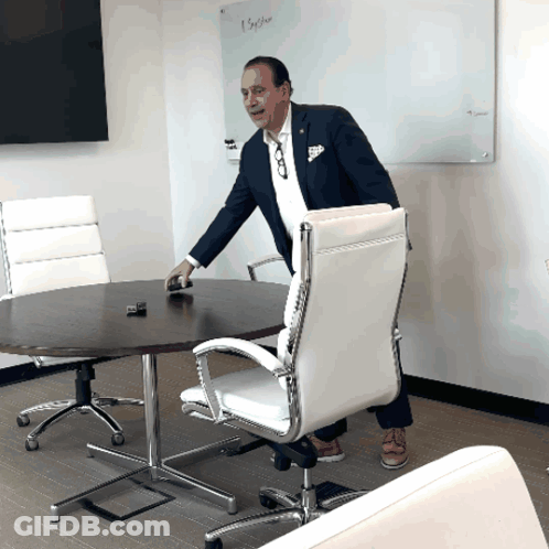 Man In Suit In Front Of White Board Saying Before GIF