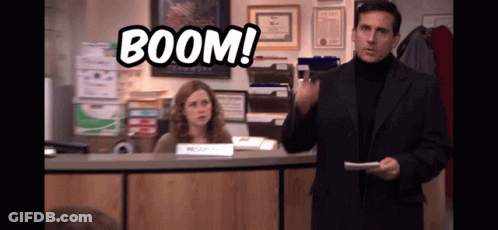 Man In Suit In Front Of Woman Behind Counter With Boom GIF