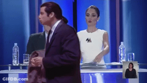Man In Suit In Front Of Woman With Letter A GIF