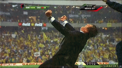 Man In Suit Jumping At Coca-Cola Soccer Game GIF