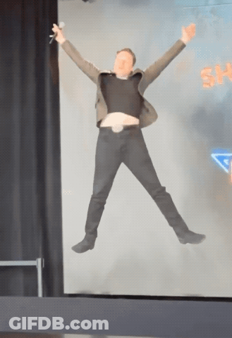 Man In Suit Jumping In Front Of Sky Screen GIF