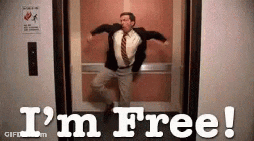 Man In Suit Jumping Out Of Elevator I M Free GIF