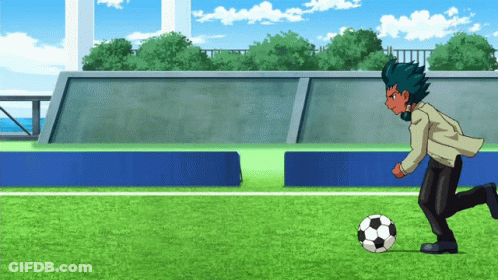 Man In Suit Kicking Soccer Ball GIF