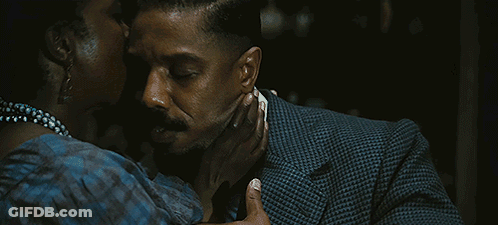 Man In Suit Kissing Woman GIF