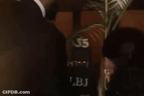 Man In Suit Kissing Woman GIF