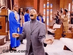 Man In Suit Kneeling Before Church Choir GIF