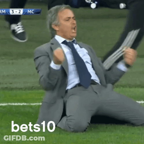 Man In Suit Kneeling On Field GIF
