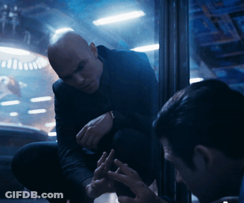 Man In Suit Kneeling Talking To Man GIF