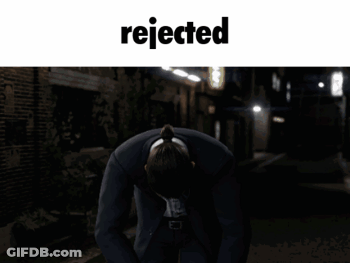 Man In Suit Kneeling With Word Rejected GIF