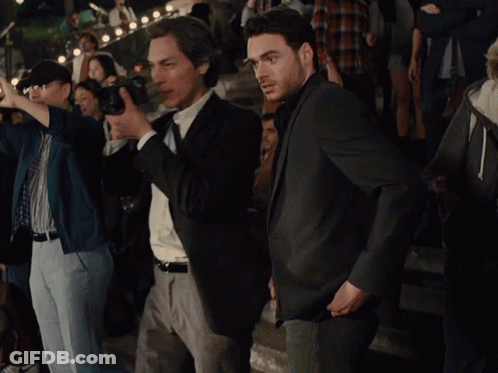 Man In Suit Laughing And Clapping GIF
