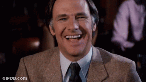 Man In Suit Laughing And Smiling GIF