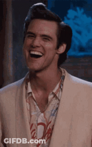Man In Suit Laughing And Smiling GIF