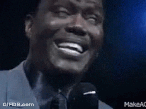 Man In Suit Laughing And Speaking GIF
