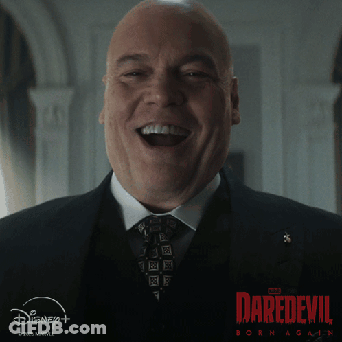 Man In Suit Laughing At Daredevil Poster GIF