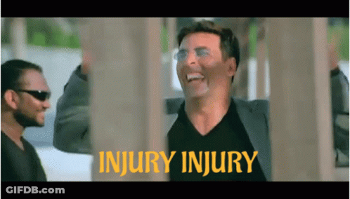 Man In Suit Laughing At Injury Injury Sign GIF