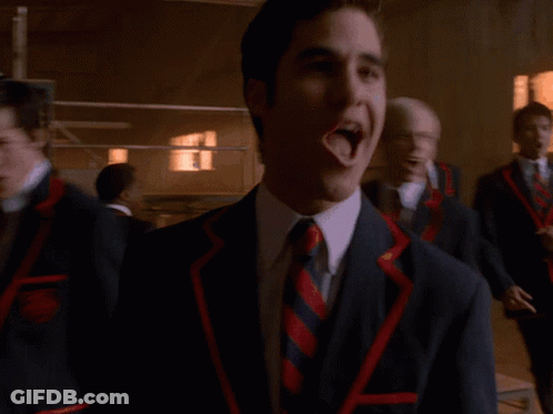 Man In Suit Laughing Beside Two Men GIF