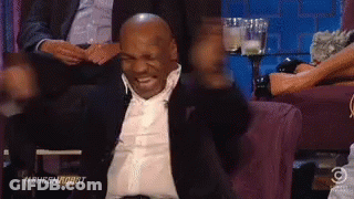 Man In Suit Laughing GIF
