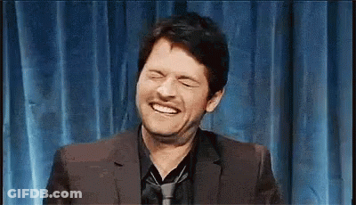 Man In Suit Laughing Eyes Closed GIF