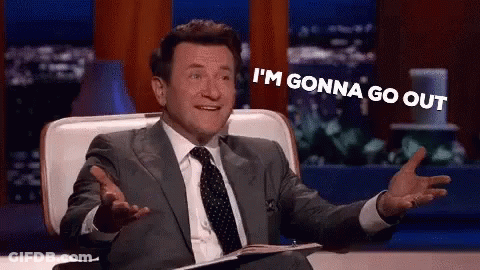 Man In Suit Laughing Holding Notebook GIF