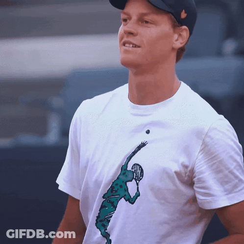 Man In Suit Laughing In Front Of Super Tennis Logo GIF