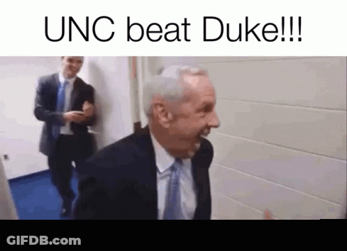 Man In Suit Laughing In Hallway GIF