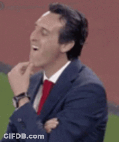 Man In Suit Laughing On Soccer Field GIF