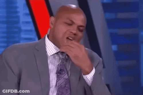 Man In Suit Laughing On TV Show GIF