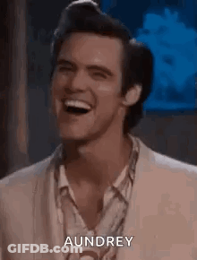 Man In Suit Laughing With Audrey GIF