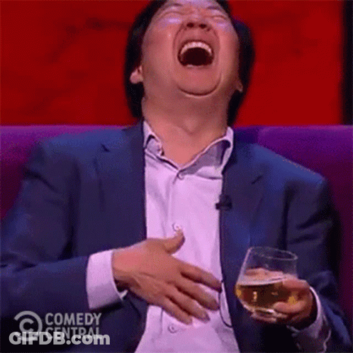 Man In Suit Laughing With Beer GIF