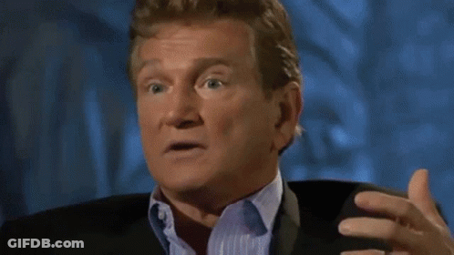 Man In Suit Laughing With Eyes Closed GIF