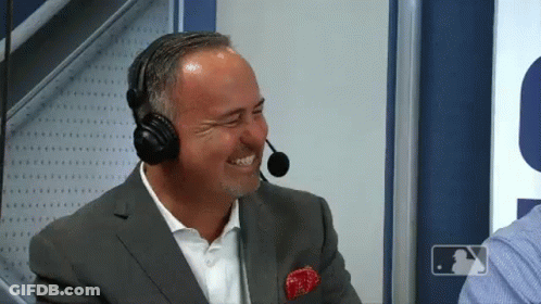 Man In Suit Laughing With Headphones And Microphone GIF