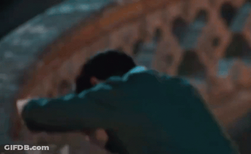 Man In Suit Laying Head On Railing GIF