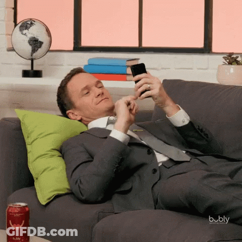 Man In Suit Laying On Couch With Bubbly GIF