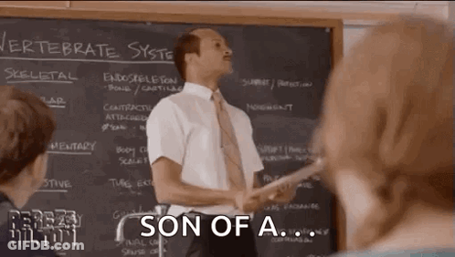 Man In Suit Lecturing To Students By Chalkboard GIF