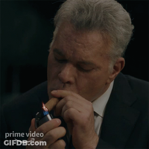 Man In Suit Lighting Cigarette With Prime Video Logo GIF