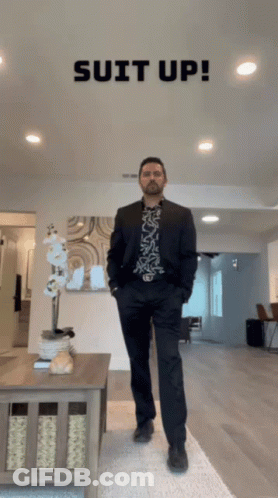 Man In Suit Living Room Saying Suit Up GIF