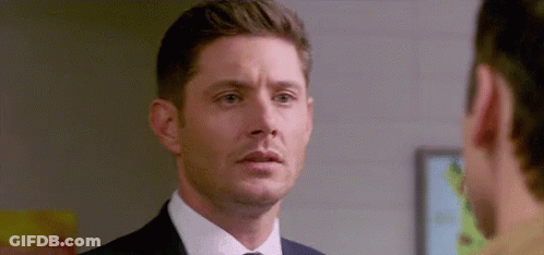 Man In Suit Looking At Another Man GIF