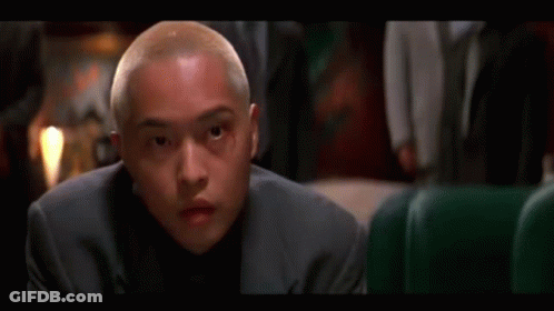 Man In Suit Looking At Camera GIF