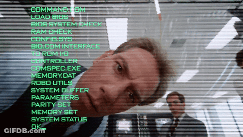 Man In Suit Looking At Command.com Screen GIF