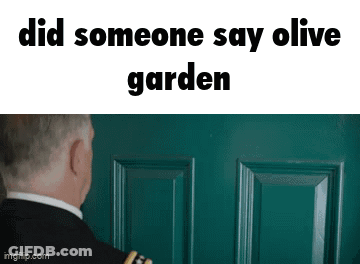Man In Suit Looking At Green Door GIF