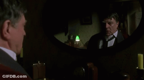 Man In Suit Looking At Mirror GIF