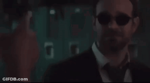 Man In Suit Looking At Screen GIF