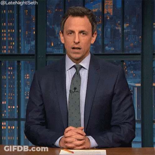 Man In Suit Looking At Watch At Desk GIF