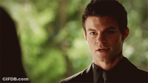 Man In Suit Looking At Woman GIF