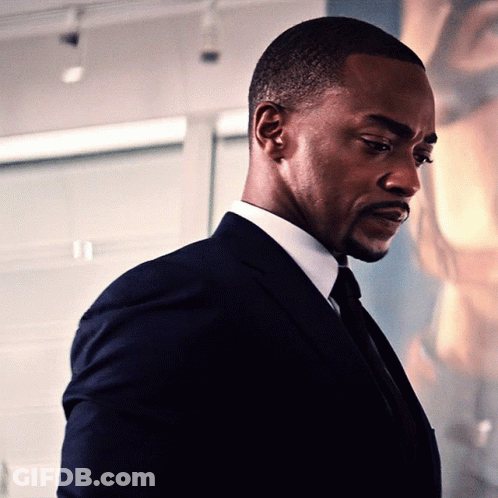 Man In Suit Looking Down GIF