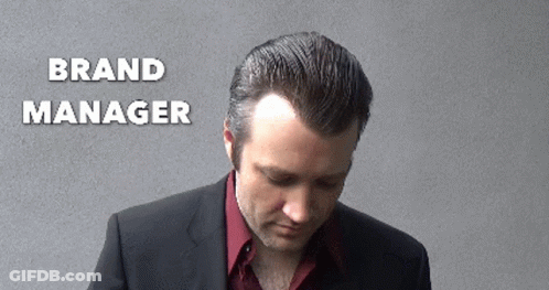 Man In Suit Looking Down Brand Manager GIF