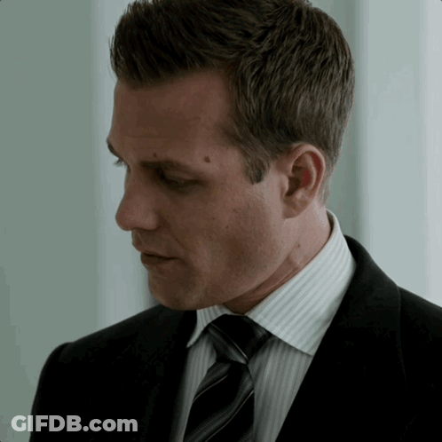Man In Suit Looking Down Eyes Closed GIF
